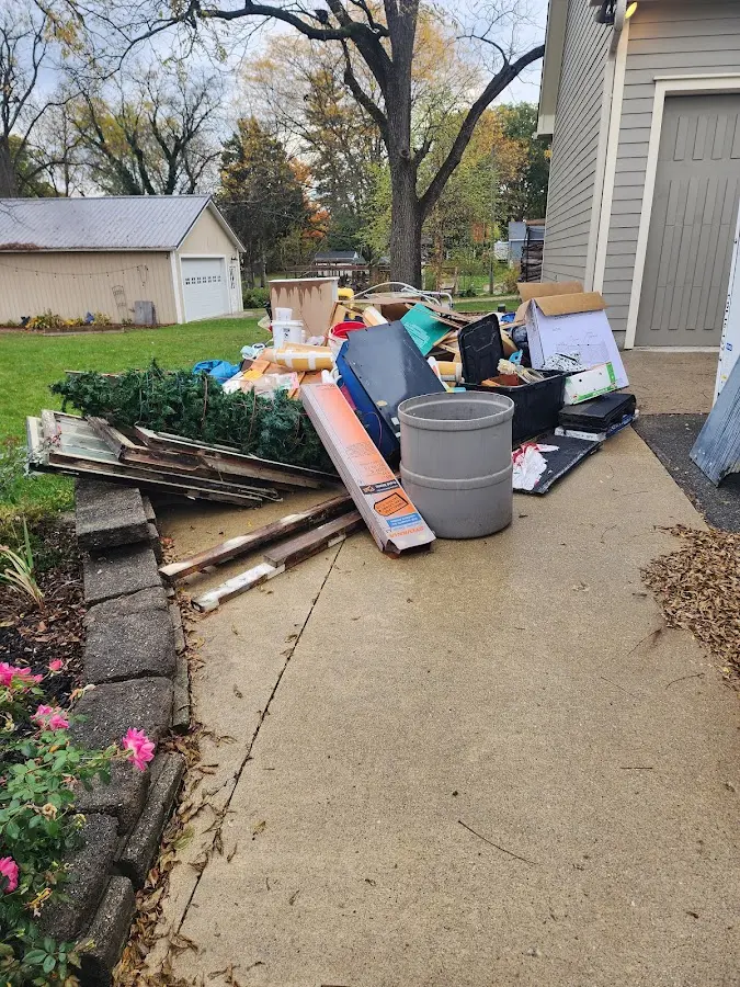 Dumpster being loaded with debris for Residential Dumpster Rental in North Wilkesboro